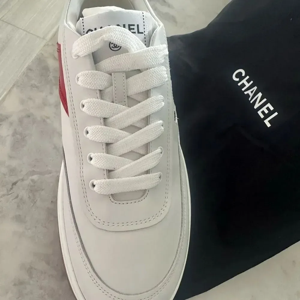 Chanel Woman’s White Sneakers with red and grey CC logo